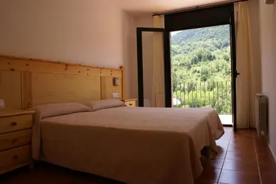 Cama o camas de una habitación en Apartamentos Casa Masover