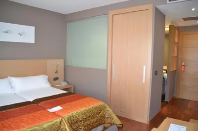 Cama o camas de una habitación en Hotel Vilar Riu de Baix
