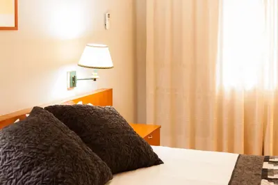Cama o camas de una habitación en Hostal Restaurant Roma