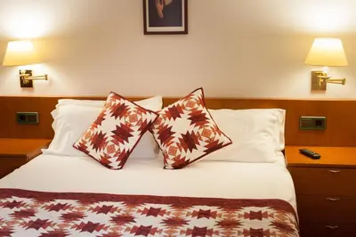 Cama o camas de una habitación en Hostal Restaurant Roma