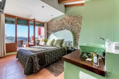 Cama o camas de una habitación en Hotel Cal Llop