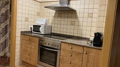 Una cocina o zona de cocina en Apartamentos Casa Lola Beceite, terraza y barbacoa