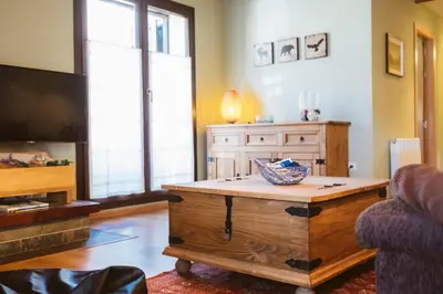 Una televisión o centro de entretenimiento en Apartamento Garona