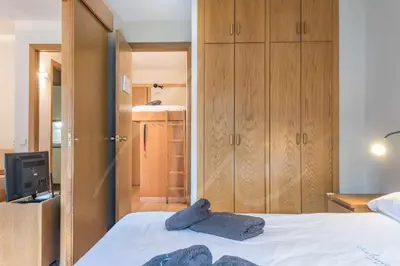 Cama o camas de una habitación en Solneu by SeaMount Rentals
