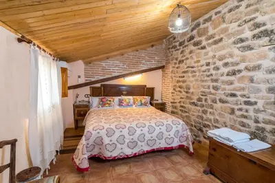 Cama o camas de una habitación en Casa rural Rosa