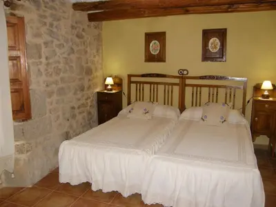Cama o camas de una habitación en Casa rural Rosa