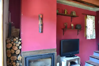 Una televisión o centro de entretenimiento en Casa JUNIA