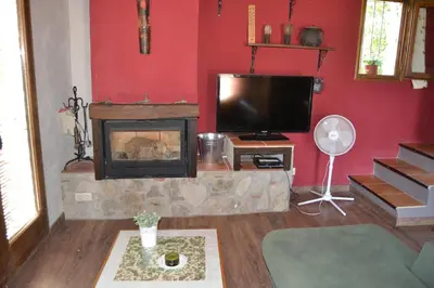 Una televisión o centro de entretenimiento en Casa JUNIA