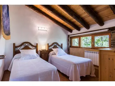 Cama o camas de una habitación en Casas Rurales Molinias