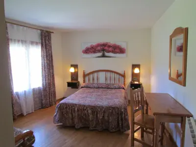 Cama o camas de una habitación en Hotel Las Nieves