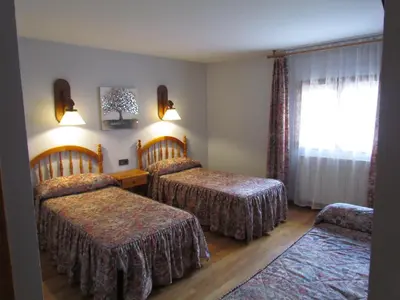 Cama o camas de una habitación en Hotel Las Nieves