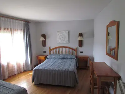 Cama o camas de una habitación en Hotel Las Nieves