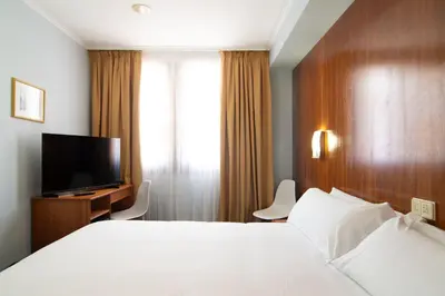 Cama o camas de una habitación en Hotel Beratxa