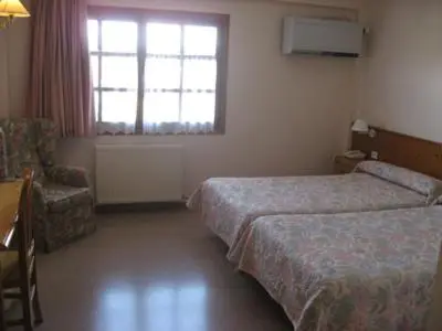 Cama o camas de una habitación en Hotel Anaya