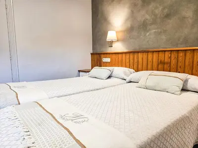 Cama o camas de una habitación en Hotel Casa Morlans 3000