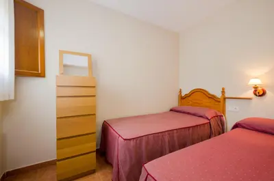 Cama o camas de una habitación en Apartamentos Casa Aurelia