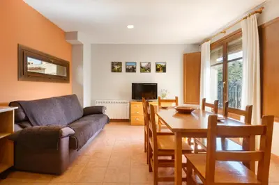 Una televisión o centro de entretenimiento en Apartamentos Casa Aurelia