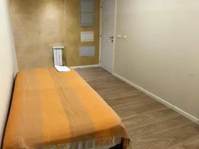 Cama o camas de una habitación en Apartamentos Villava Pamplona