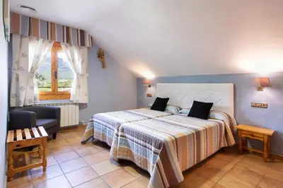 Cama o camas de una habitación en Apartamentos Cinca