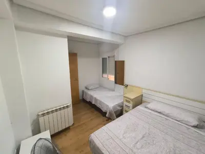 Cama o camas de una habitación en Piso Avenida de Madrid