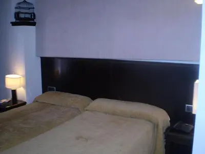 Cama o camas de una habitación en Posada Arco de San Miguel