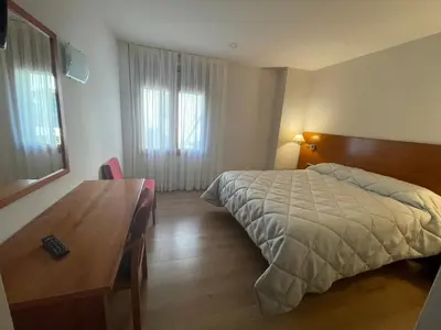 Cama o camas de una habitación en Hotel Arturo