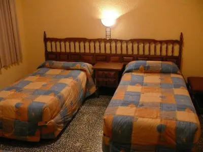 Cama o camas de una habitación en Hostal Rodes