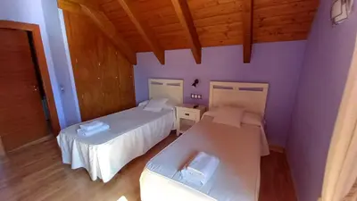 Cama o camas de una habitación en Hostal Rural Casa Parda