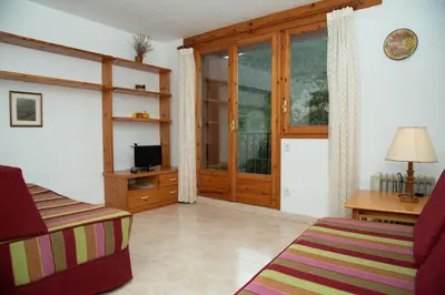 Una televisión o centro de entretenimiento en Casa Rural Cal Bosch