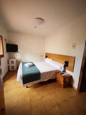 Cama o camas de una habitación en Hostal Legaz