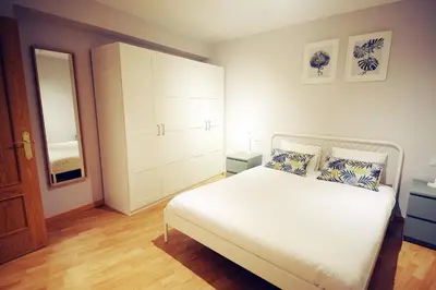 Cama o camas de una habitación en DONES Apartamento en el Casco Histórico de Zaragoza