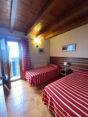 Cama o camas de una habitación en Aparthotel Areu