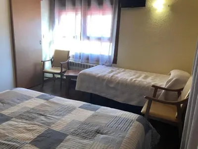Cama o camas de una habitación en Hotel Sarao 3000