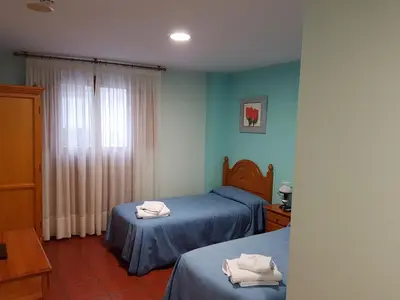 Cama o camas de una habitación en HOSTAL ITXASO-ENEA