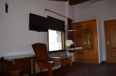 Una televisión o centro de entretenimiento en Casa Rural La Vall del Cadi