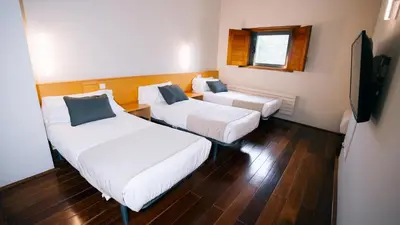 Cama o camas de una habitación en Hostatgeria de Poblet