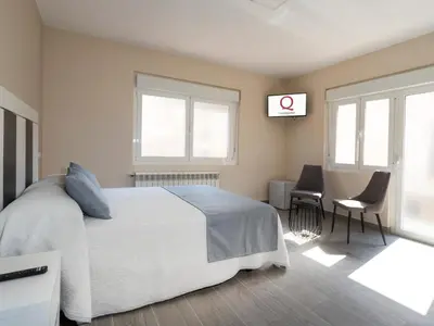 Cama o camas de una habitación en Hotel Querol