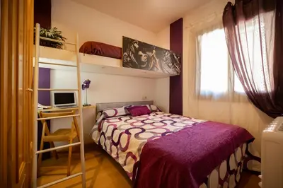 Cama o camas de una habitación en Inmocyma Antigua Casa Chuanina, bajo-Benasque