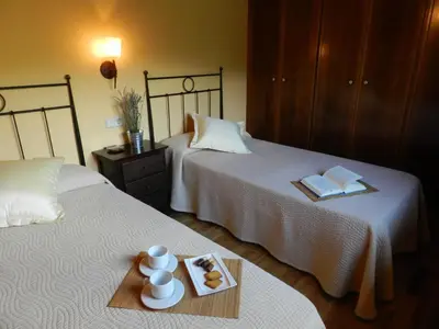 Cama o camas de una habitación en El Tossalet Turismo rural