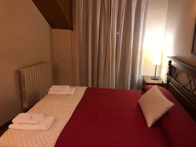 Cama o camas de una habitación en Apartamentos Casa Lavedan