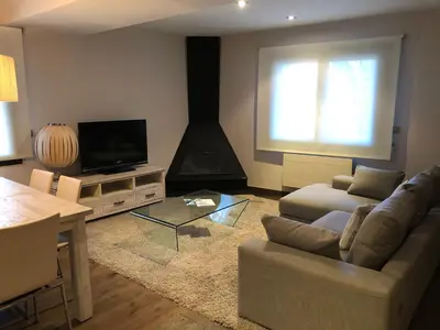 Una televisión o centro de entretenimiento en Apartament Casa Rey