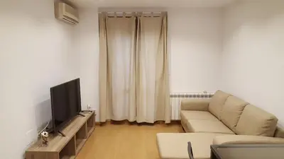 Una televisión o centro de entretenimiento en Apartamenticos Boggiero II