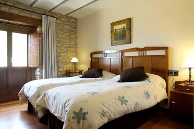 Cama o camas de una habitación en CASA RURAL FERNANDOEGEA