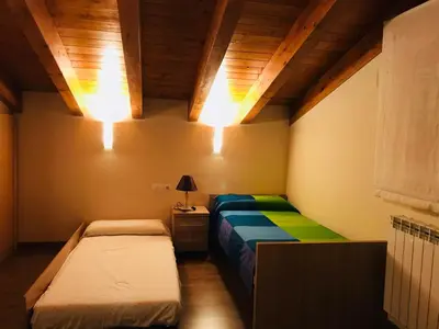 Cama o camas de una habitación en Puerta de Sobrarbe - Torreciudad