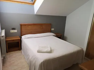 Cama o camas de una habitación en Ciudad de Jaca
