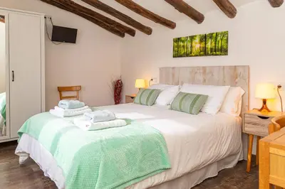 Cama o camas de una habitación en Casa rural 