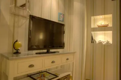 Una televisión o centro de entretenimiento en Apartamentos Rurales El Rapallo