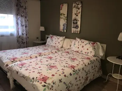 Cama o camas de una habitación en Alojamientos Iruña