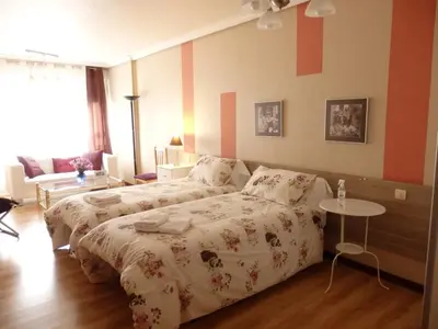 Cama o camas de una habitación en Alojamientos Iruña