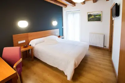 Cama o camas de una habitación en Allotjament Rural Cal Miquel